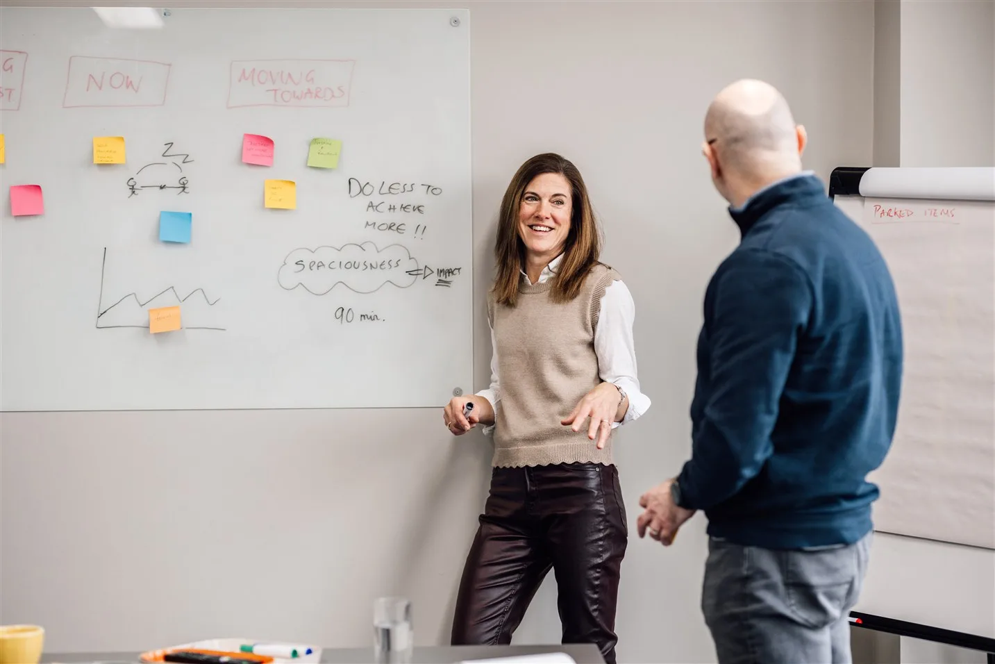 Lisa working one to one with a client at a desk