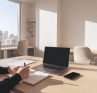 Person taking time to pause and think away from their computer, in a light-filled office