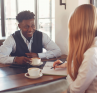 A leader having a check-in with a member of their team