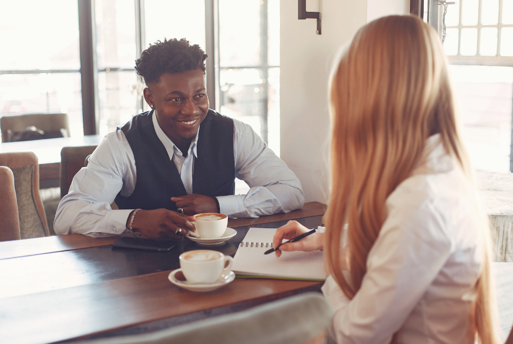 A leader having a check-in with a member of their team