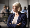 A leader intentionally pausing from the activity of a workplace.
