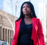 A young professional walking through a city