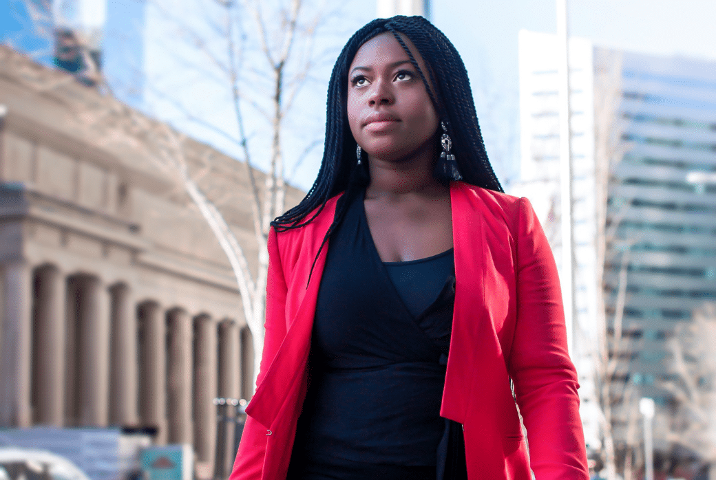 A young professional walking through a city